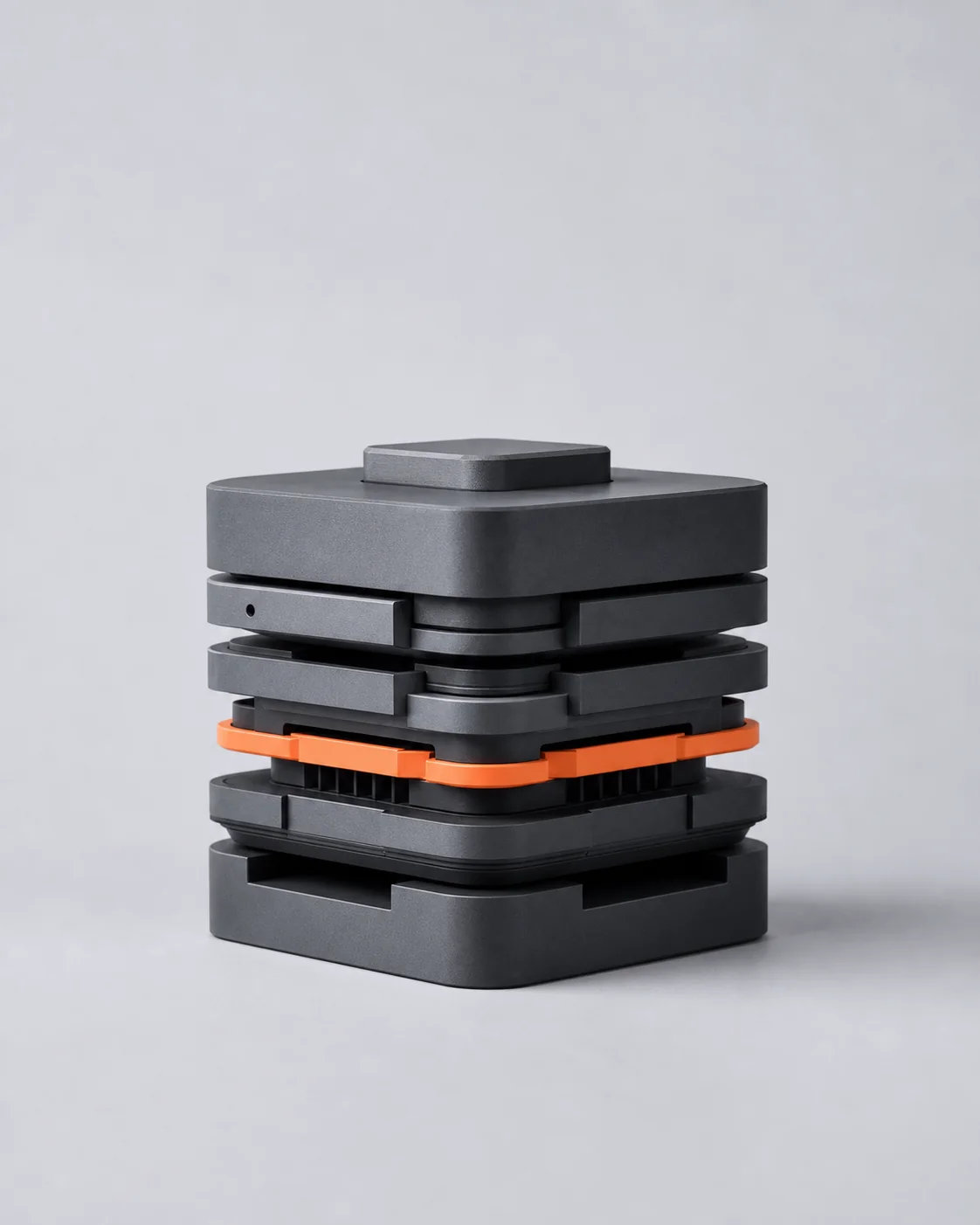 Sculptural modular operating foundation in graphite and signal orange